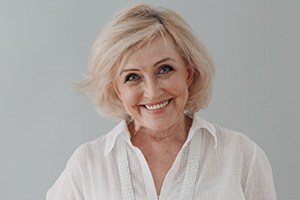 a patient with dentures smiling 