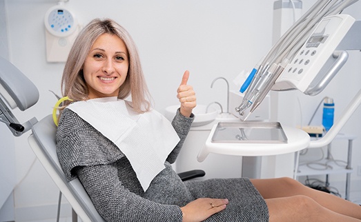 Dental patient making thumbs up gesture